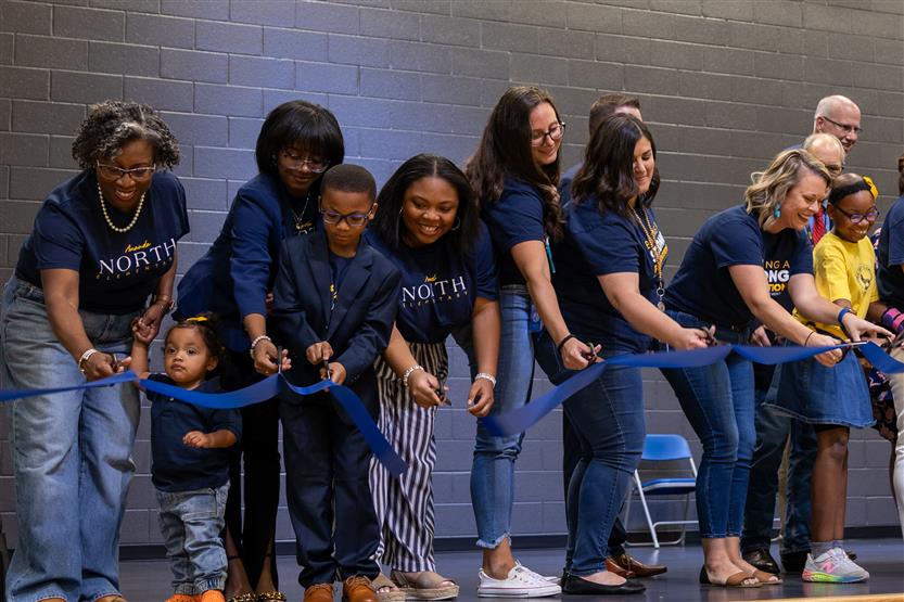 Students cut ribbon at new school